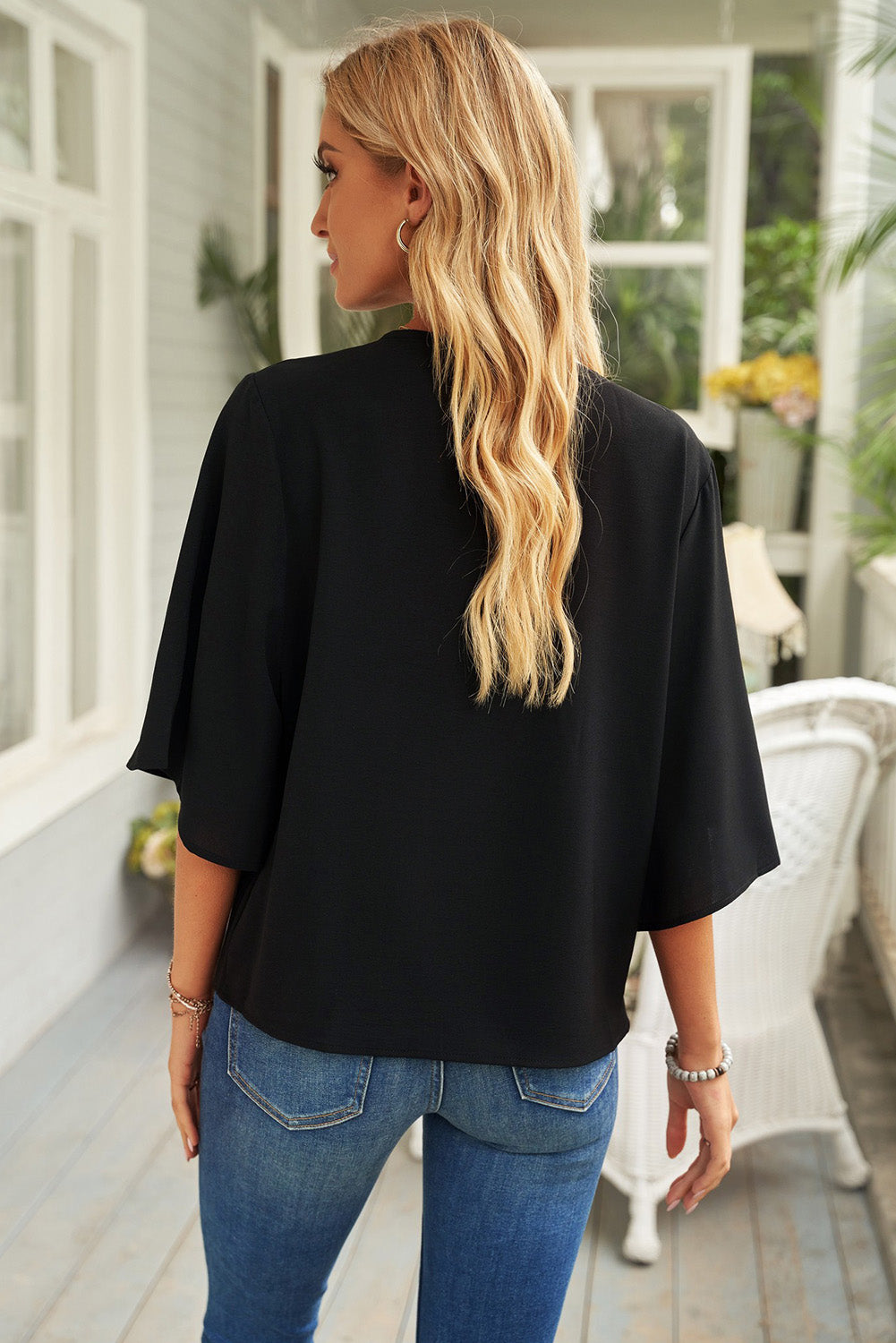 Blusa de manga tres cuartos con cuello vuelto