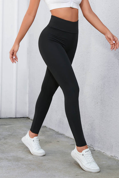 Leggings negros de cintura alta con control de barriga cruzados