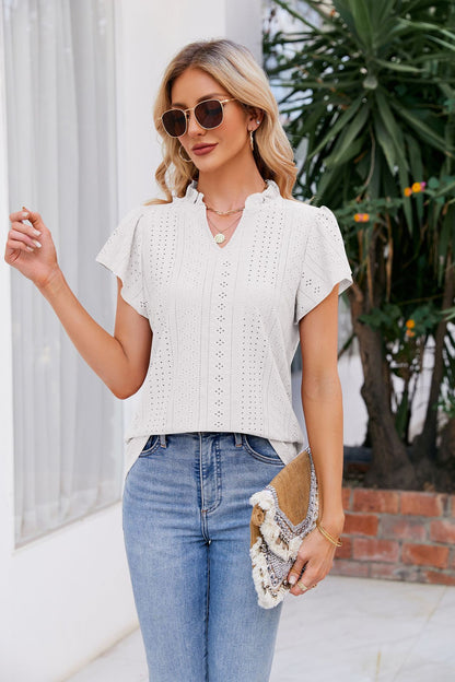 Blouse à manches bouffantes et col cranté