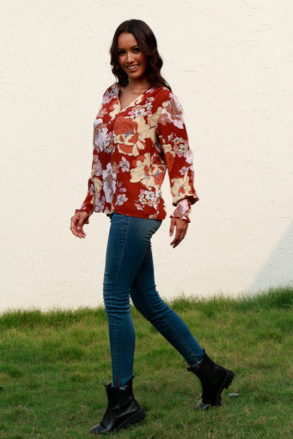 Blusa floral con cuello en V y mangas farol fruncidas