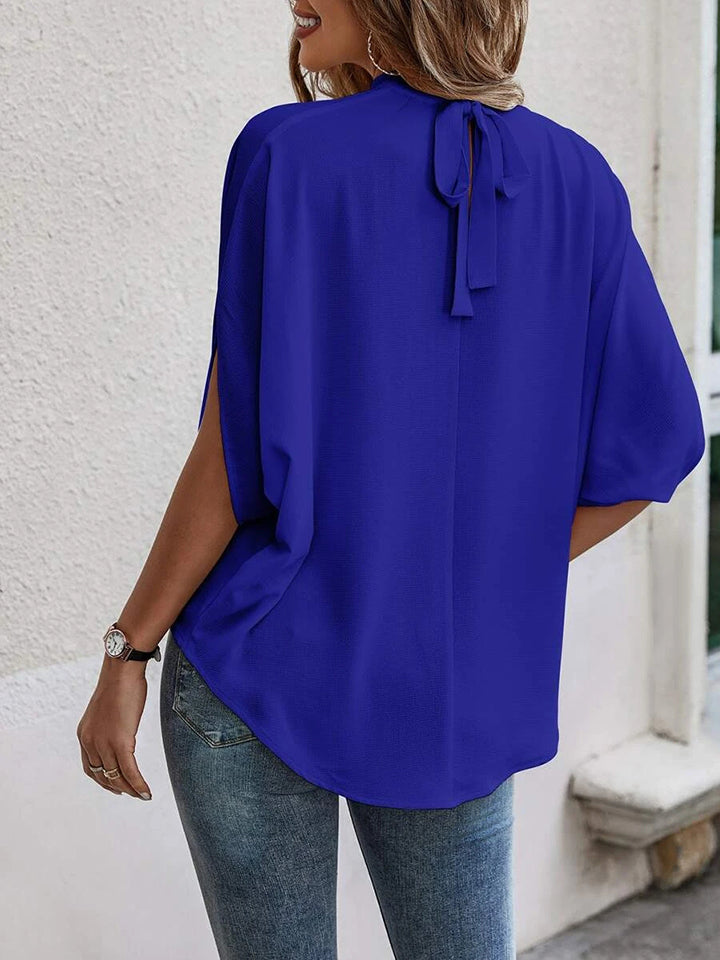 Blusa de manga con abertura y cuello redondo