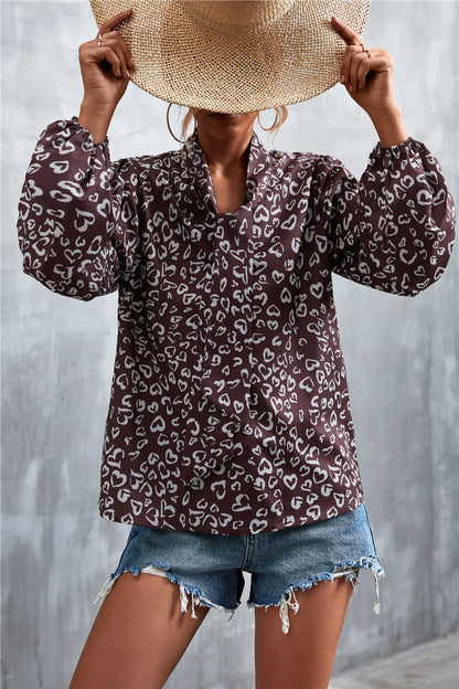 Blouse imprimée à manches bouffantes et col noué