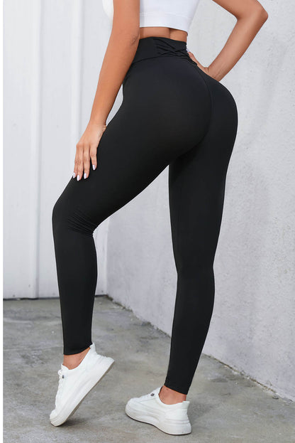 Leggings negros de cintura alta con control de barriga cruzados