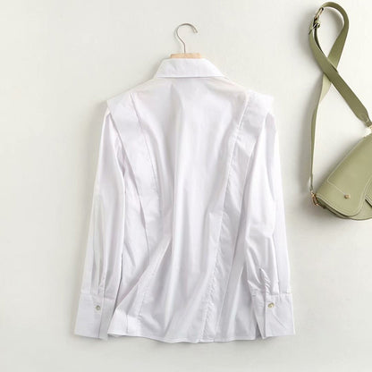 Blusa de manga larga con temperamento otoñal, camisa blanca de popelina con sentido de diseño liso para mujer