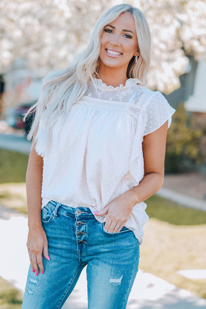 Blouse à col volanté et à pois suisses