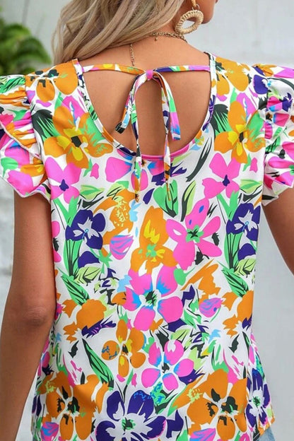 Blouse florale à manches flottantes et nouée au dos