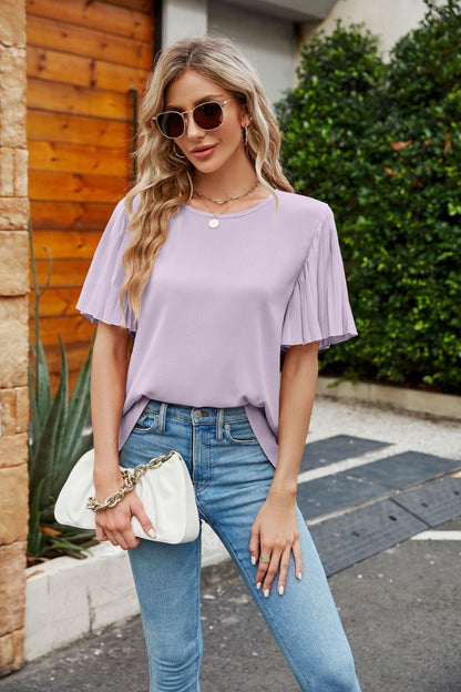 Blusa plisada con cuello redondo y mangas acampanadas