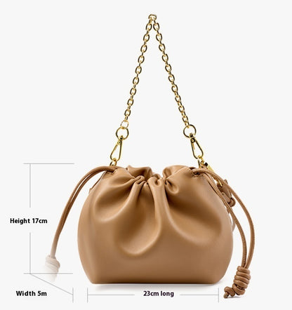 Bolso de mano de piel a juego para mujer