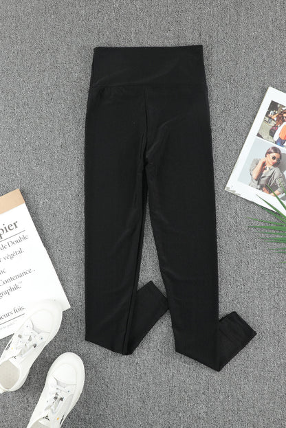 Leggings negros ajustados de talle alto con cinturilla