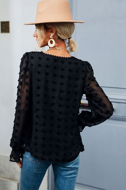 Blusa con peplum de lunares suizos