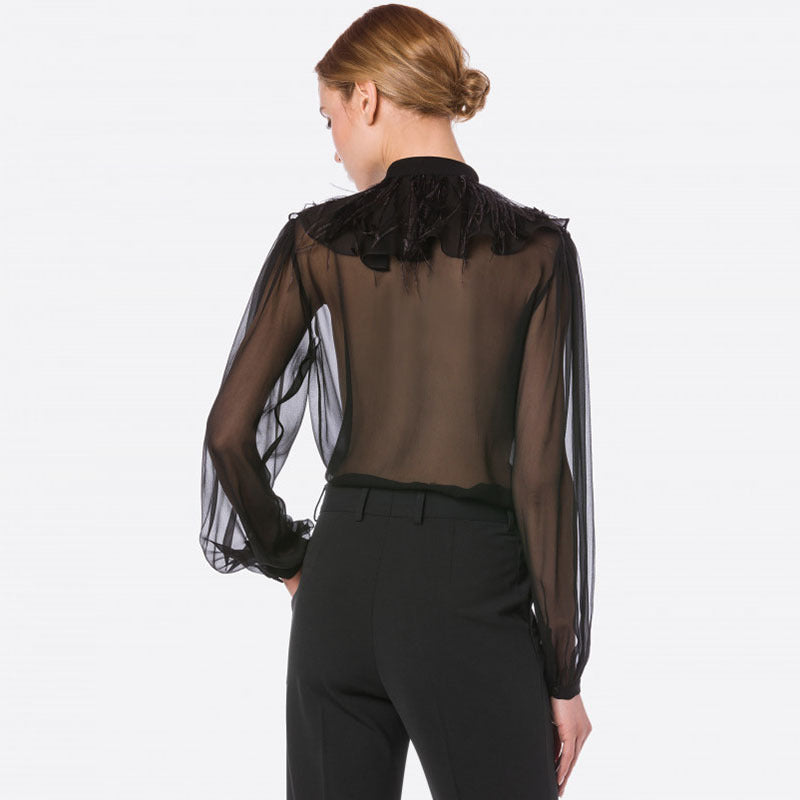 Chemise en mousseline transparente à manches longues bouffantes et col montant