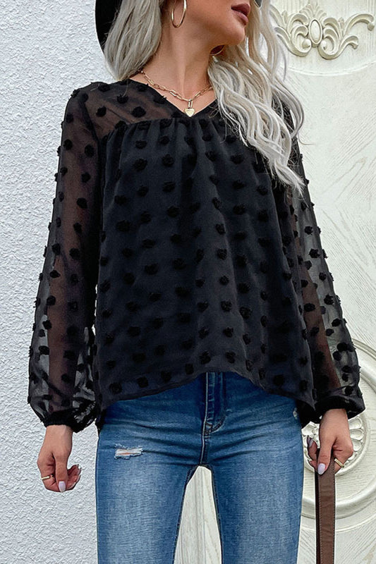 Blusa con cuello en V y lunares suizos