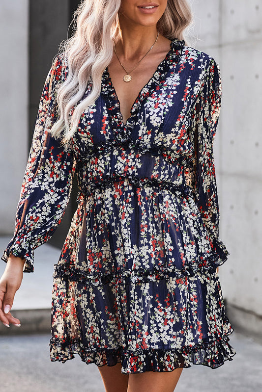 Robe florale bleue à volants et dos ouvert