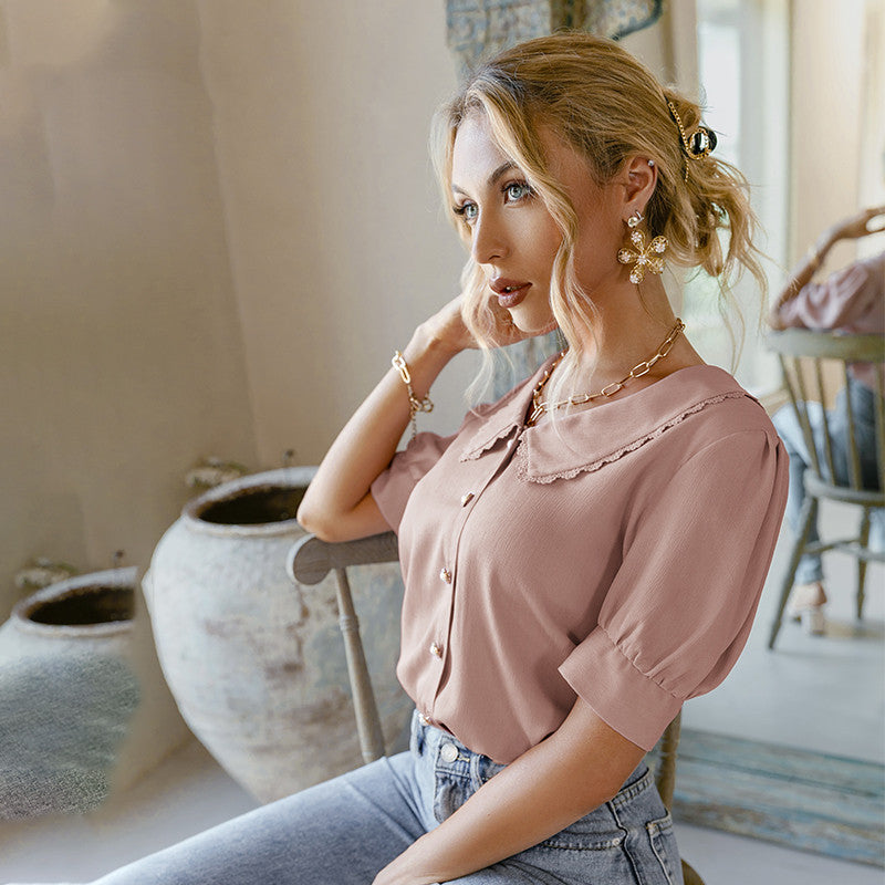 Blusa con cuello de muñeca y mangas abullonadas