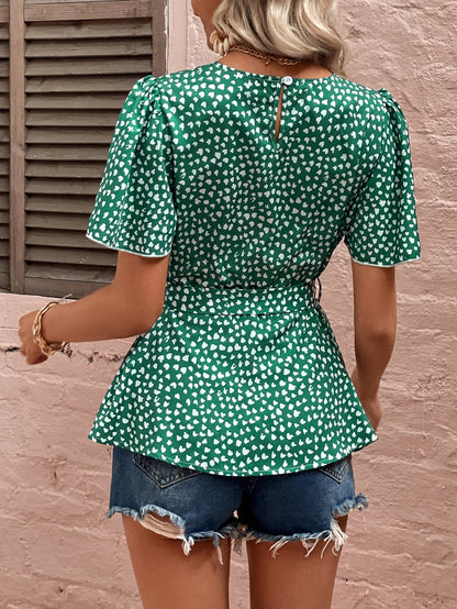 Blouse à manches bouffantes et ceinture nouée à imprimé cœur