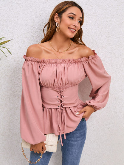 Blouse à épaules dénudées et manches ballon à lacets