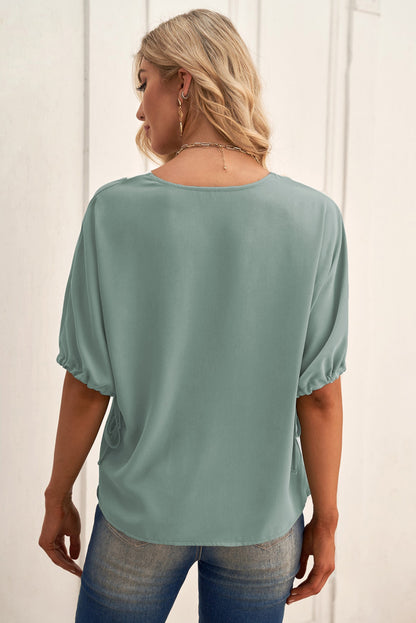 Blouse contrastée à col en V et poignets à cordon