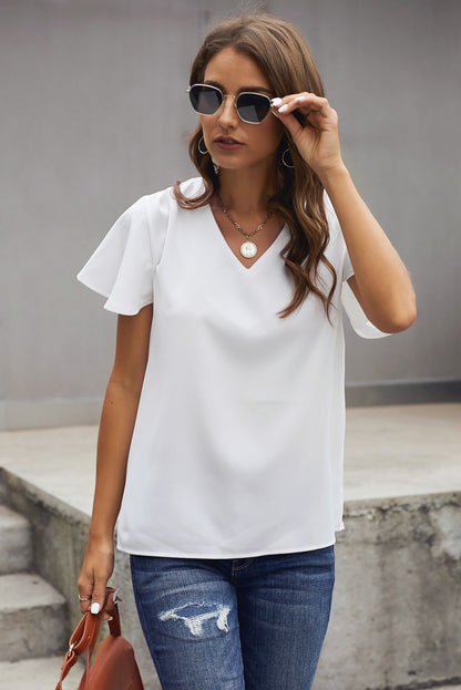 Blusa con mangas acampanadas y cuello en V