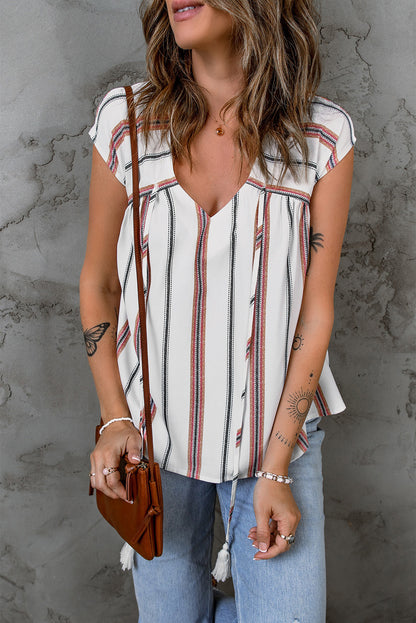 Blusa a rayas con cuello en V y borlas