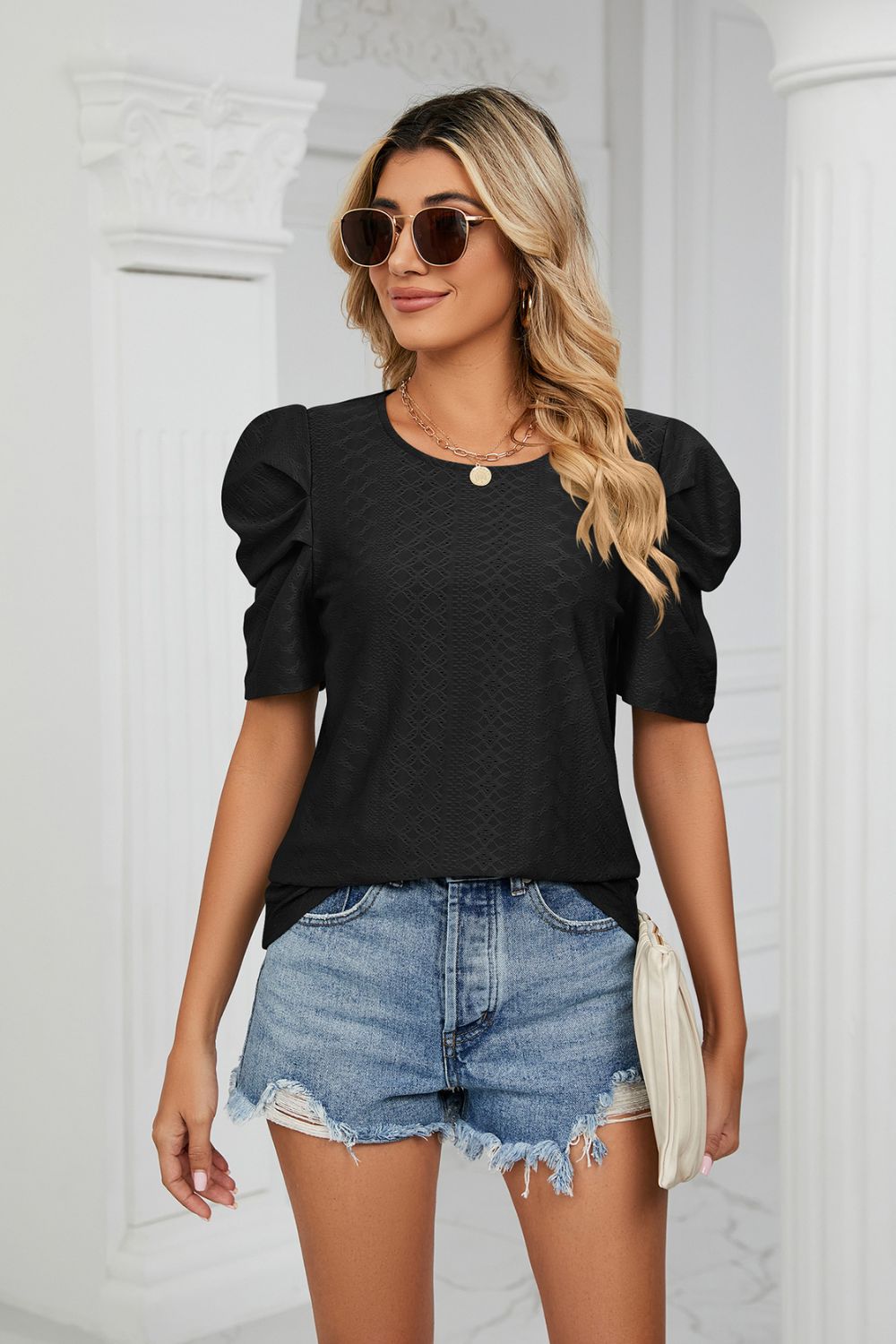 Blusa con cuello redondo y manga abullonada con ojales