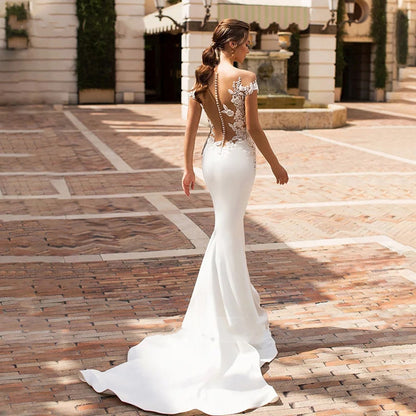 Robe de mariage en queue de poisson creuse à col profond pour femmes