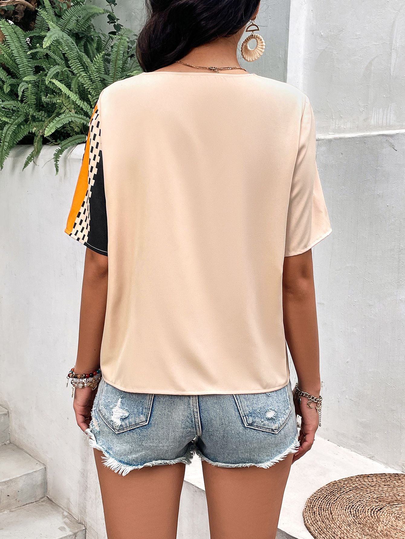 Blusa de manga acampanada con bolsillo