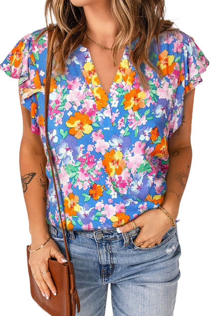 Blusa floral con cuello con muescas y mangas acampanadas