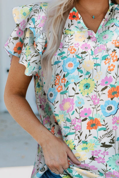 Blusa floral con mangas acampanadas en capas