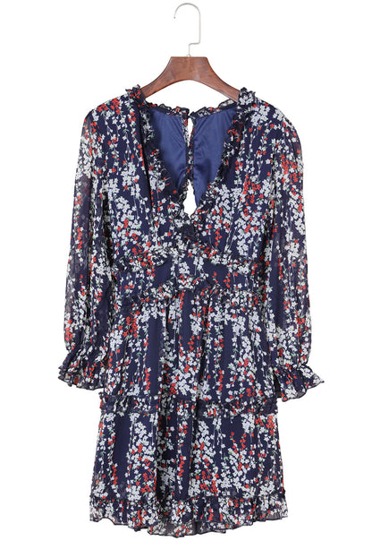 Robe florale bleue à volants et dos ouvert