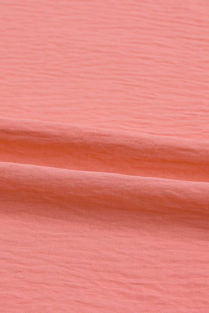 Haut rose smocké aux poignets