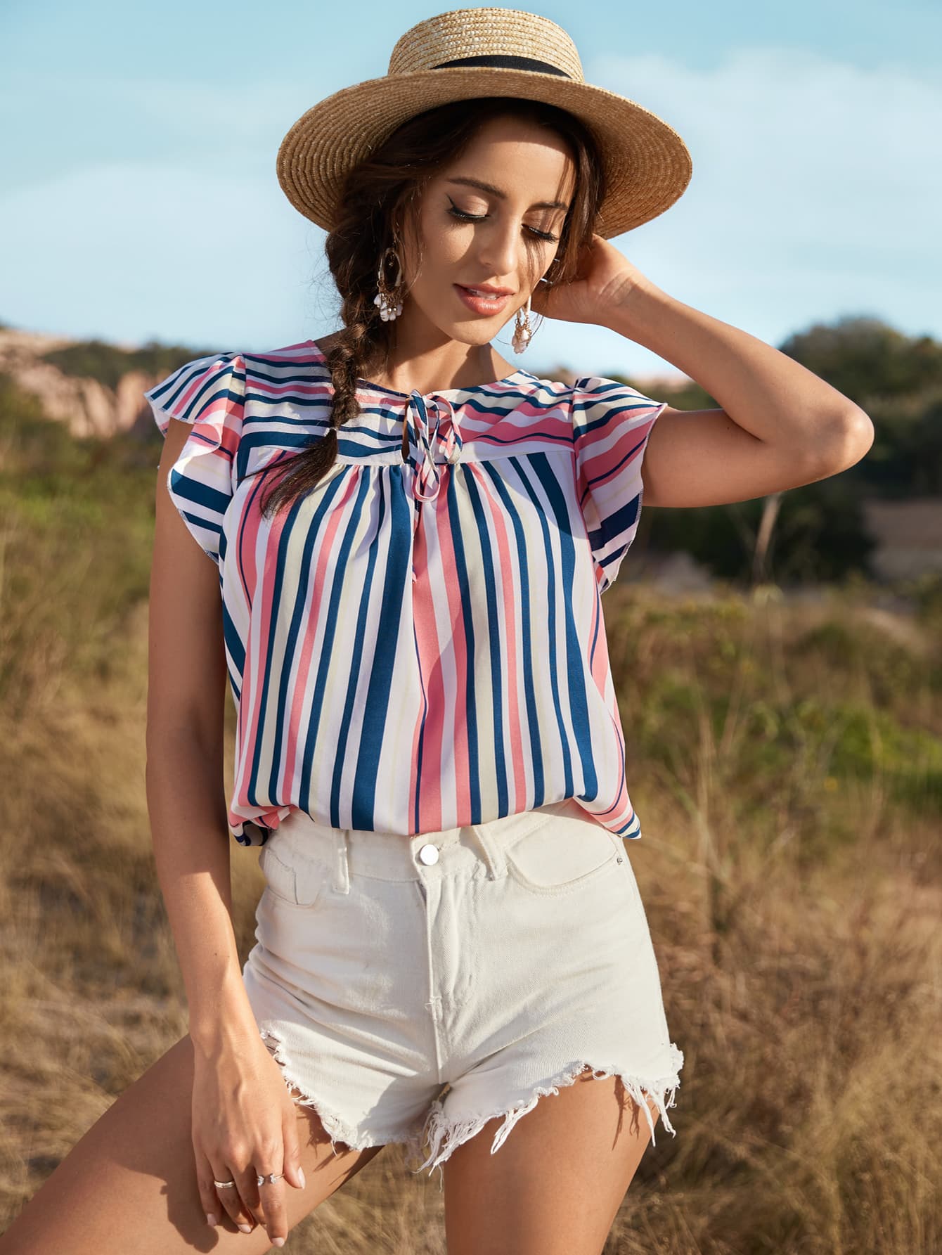 Blusa a rayas con mangas abullonadas y anudada