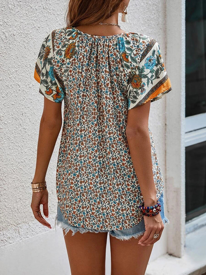 Blouse imprimée à manches courtes et col noué