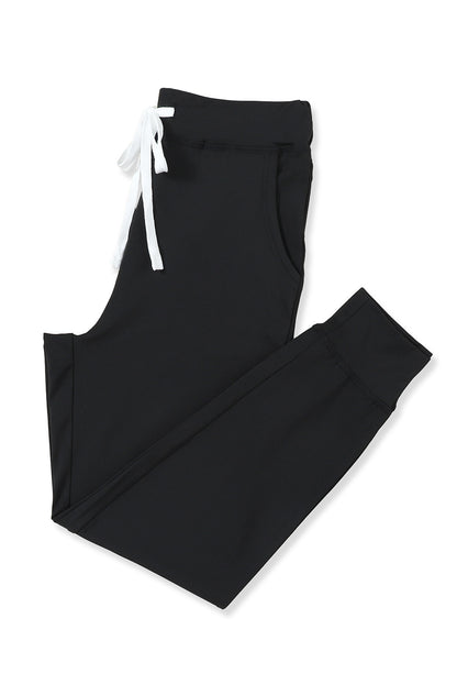 Pantalon de jogging noir avec poches à la taille et cordon de serrage