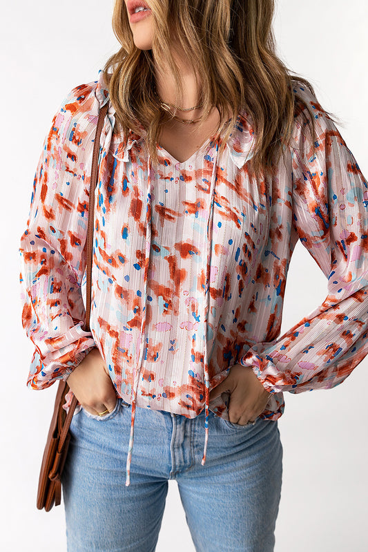 Blusa estampada con mangas globo y volantes