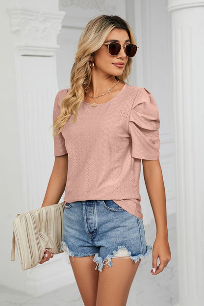 Blusa con cuello redondo y manga abullonada con ojales