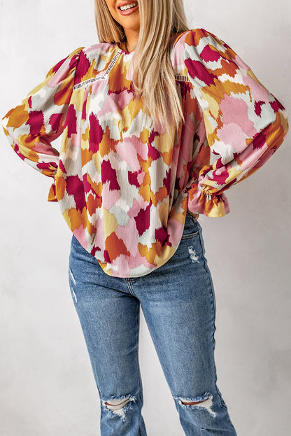 Blusa estampada con botones y mangas con volantes