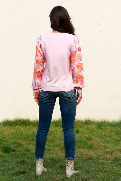 Blusa floral con cuello redondo y manga farol