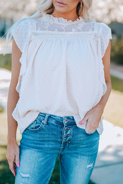 Blouse à col volanté et à pois suisses