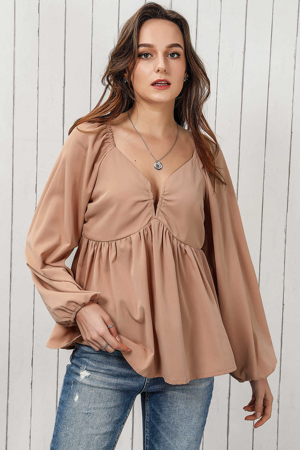 Blouse babydoll smockée à manches longues et nouée au dos