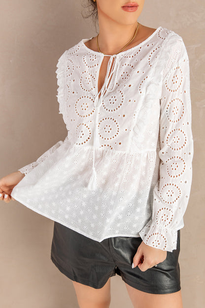 Blouse péplum à manches longues à volants et col noué à œillets