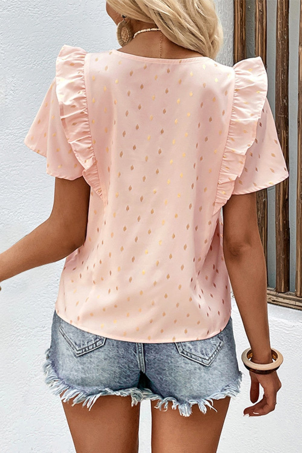 Blusa estampada con detalle plisado y ribete de volantes