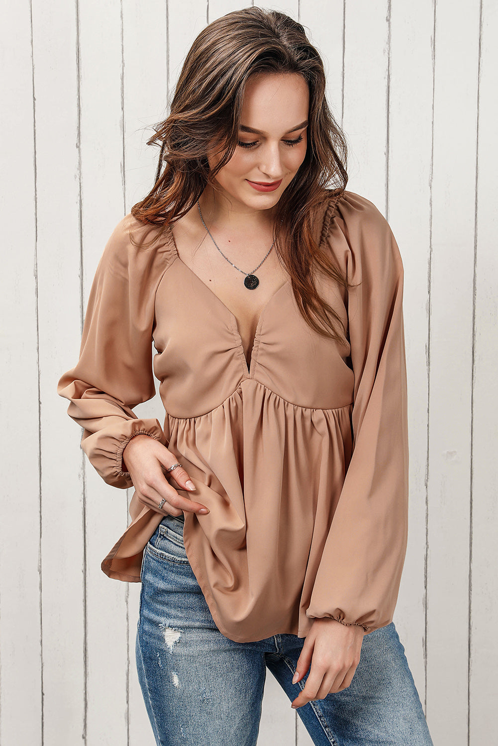 Blouse babydoll smockée à manches longues et nouée au dos