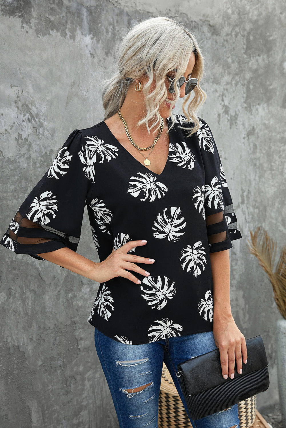 Blusa con manga abullonada y cuello en V con estampado botánico