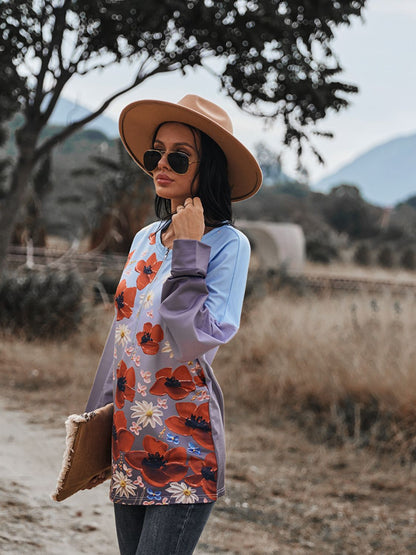 Blusa con hombros caídos y cremallera frontal con estampado floral