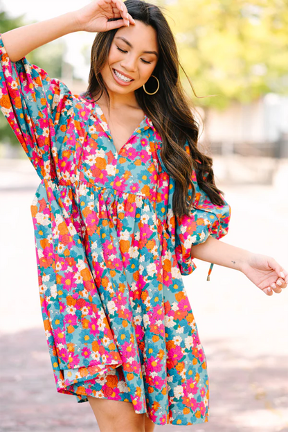 Vestido babydoll con manga de burbuja y cuello dividido con lazo y estampado floral azul cielo