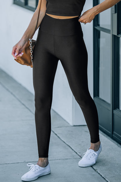 Leggings negros ajustados de talle alto con cinturilla