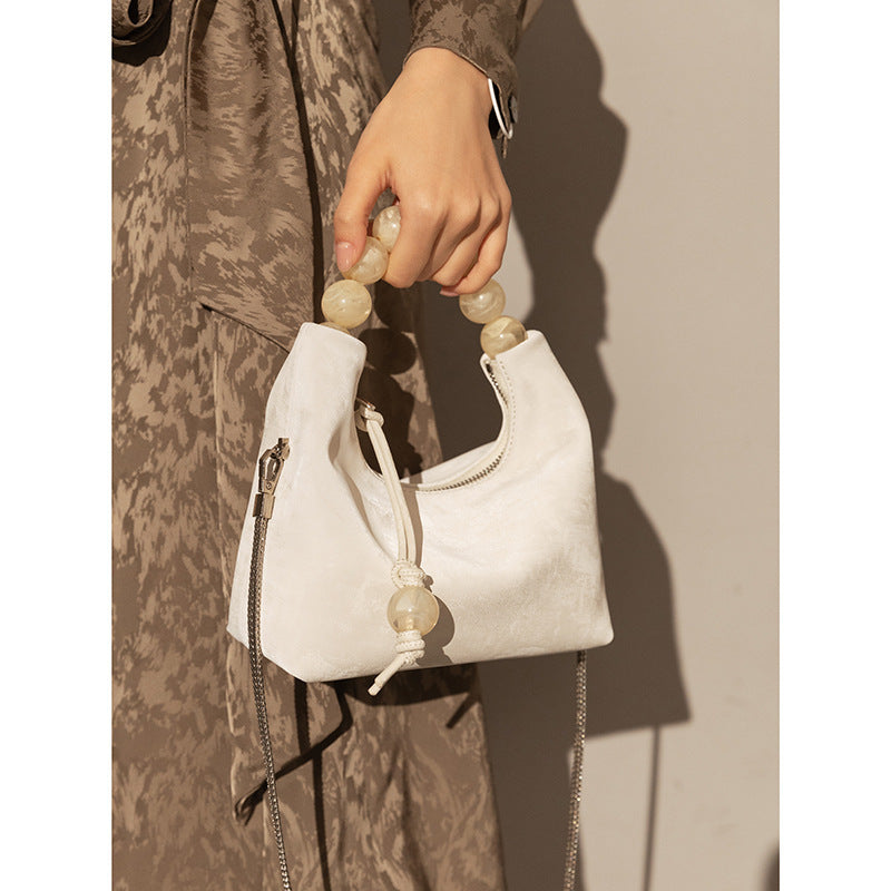 Bolso bandolera con cadena de perlas y hombro Niche