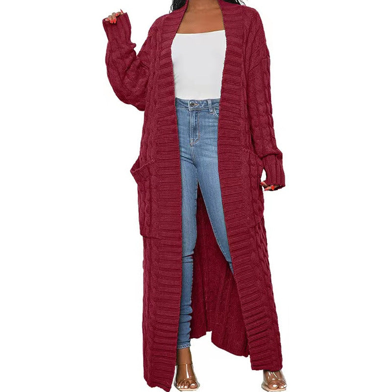 Manteau pull long torsadé avec poche paresseuse