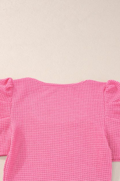 Haut froncé à manches bouffantes en tricot gaufré rose vif