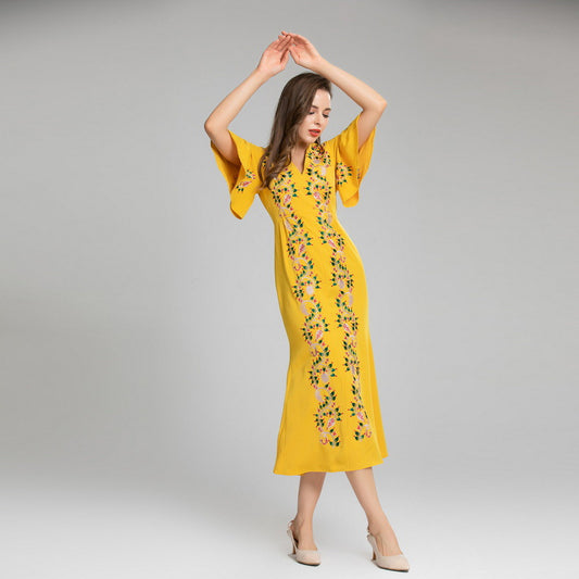 Vestido amarillo con manga de hoja de loto bordado a máquina